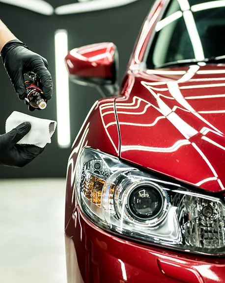 car-service-worker-applying-nano-coating-car-detail-1