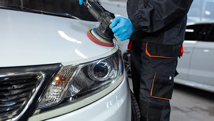 car-service-worker-polishes-car-details-with-orbital-polisherdf