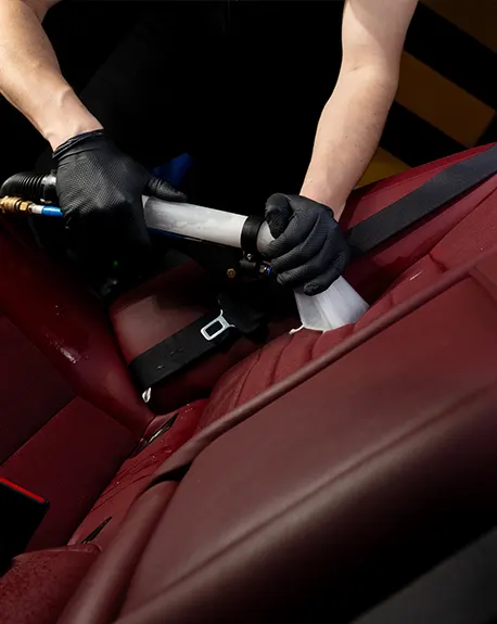 detailing-car-seats-with-help-vacuum-extractor-cleaning-car-backseat-with-special-vacuum-nozzle-01