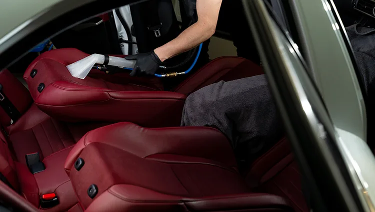detailing-car-seats-with-help-vacuum-extractor-cleaning-car-backseat-with-special-vacuum-nozzle