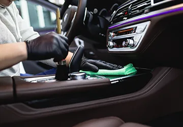 man-cleaning-car-interior-car-detailing-valeting-concept-selective-focus