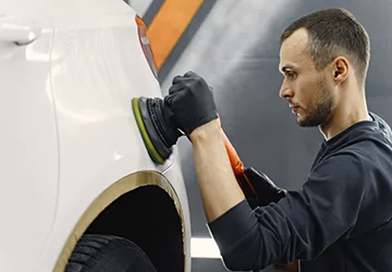 man-polish-car-garage