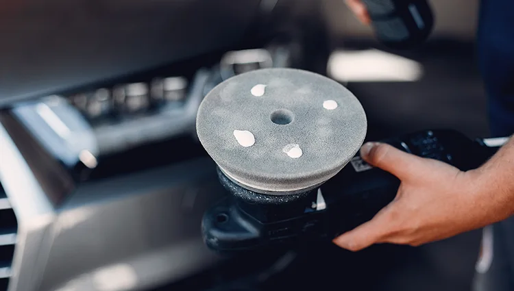 man-polish-car-garagse